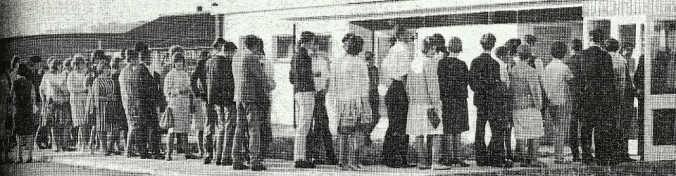 Newspaper clipping image of people queuing to enter Maxwell Park Community Centre