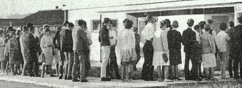 Newspaper clipping image of people queuing to enter Maxwell Park Community Centre